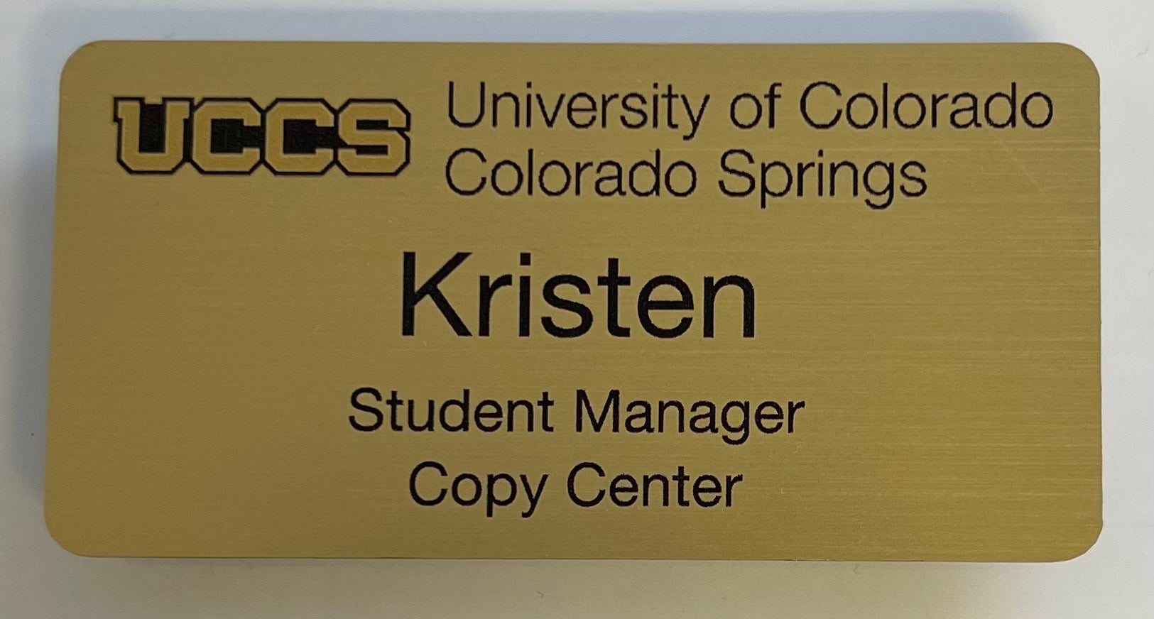 Gold name badge