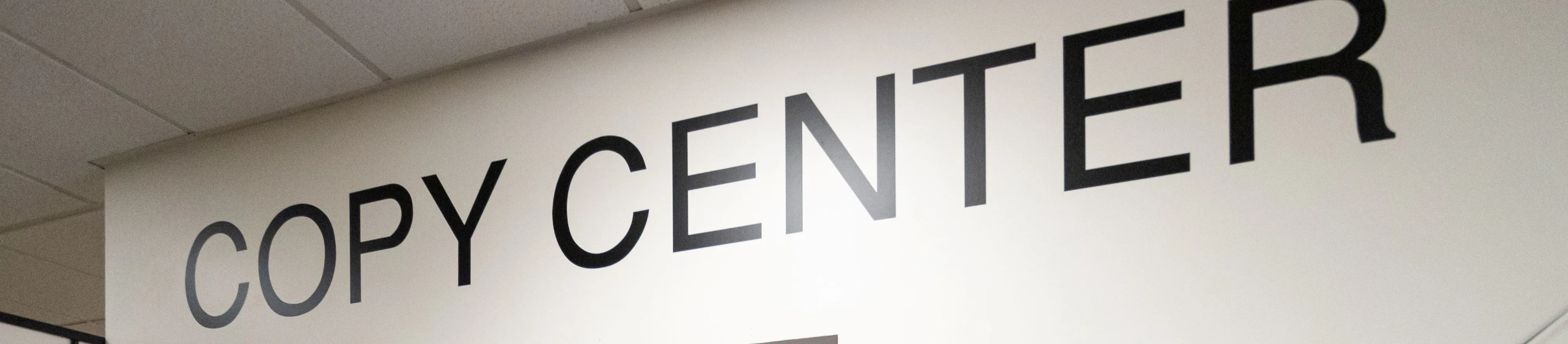 A Copy Center Employee helping a customer